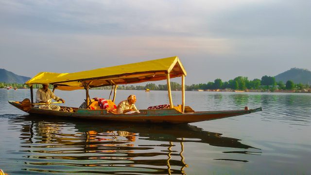 A man driving the Boat in the lake in Jammu and Kashmir