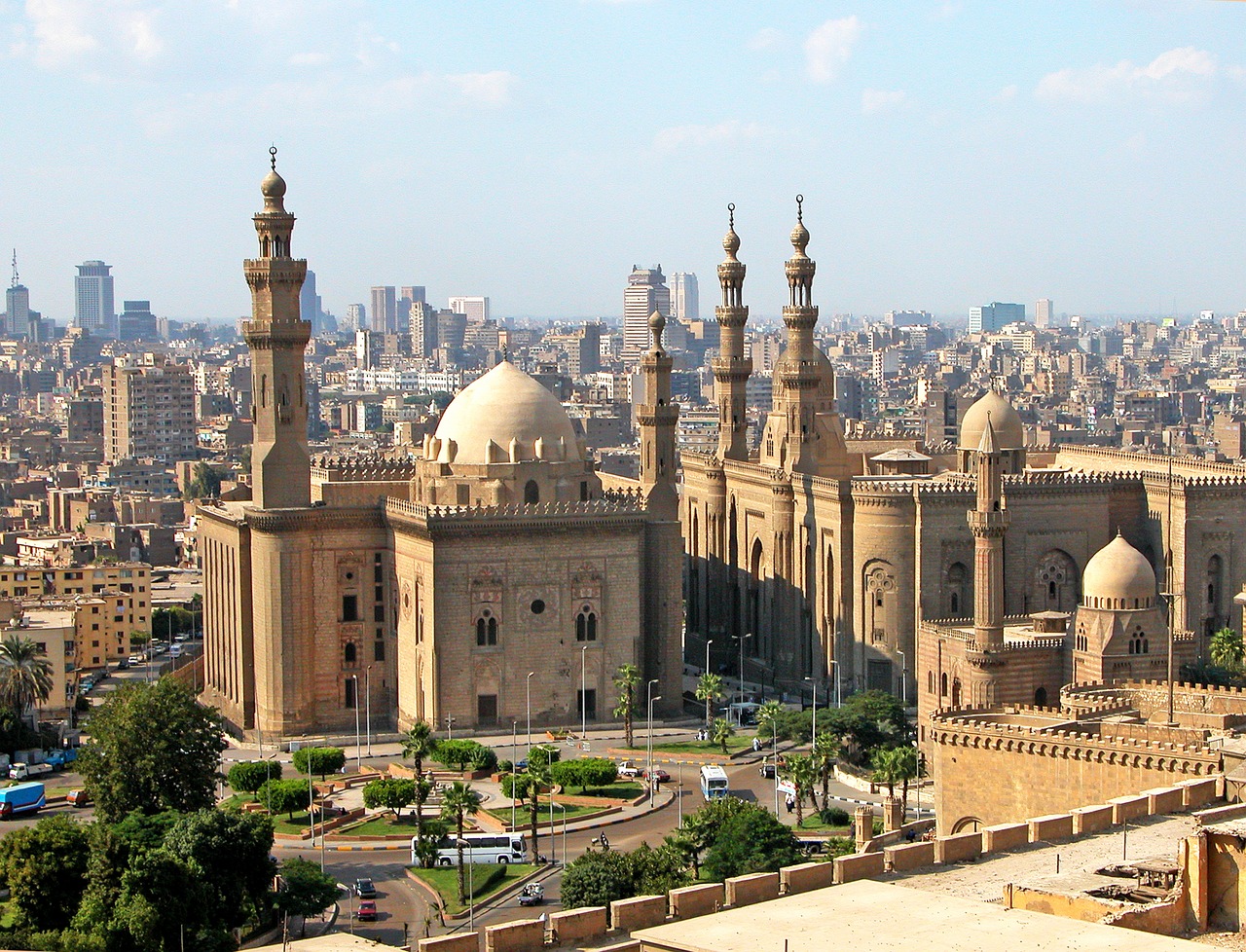 city full of brown coloured mosques