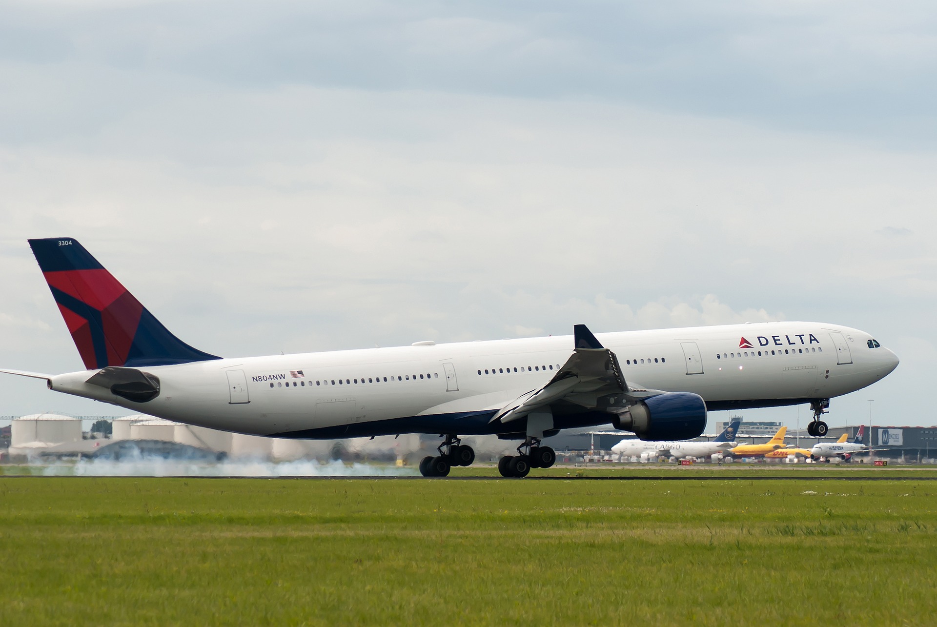 Delta aiirlines long view of the flight parked in the airport