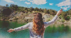 women infront of lake