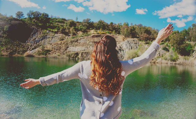women infront of lake