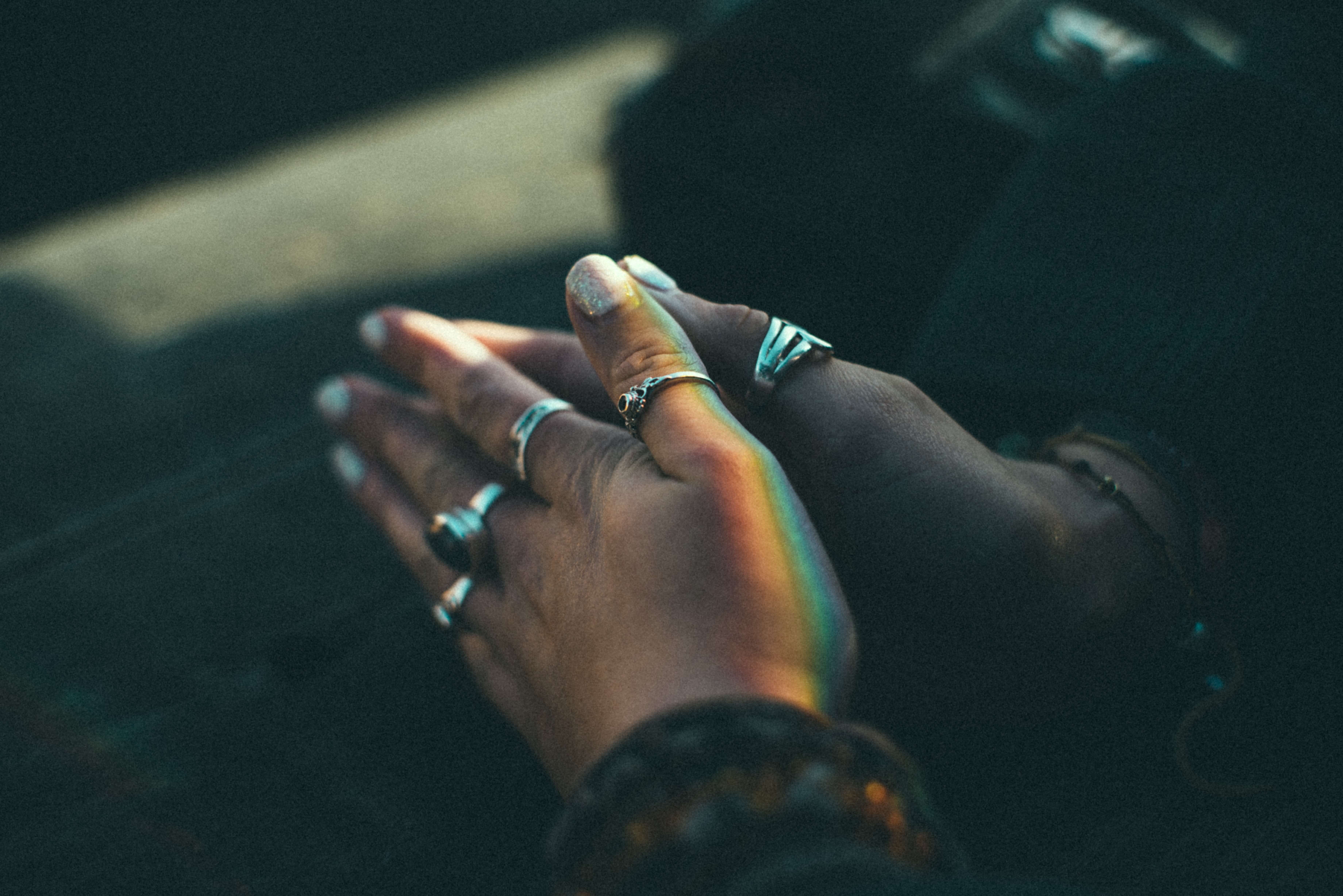 hands folded in temples