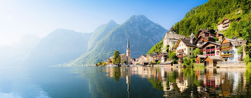 Houses Nested Between Mountains And Lake